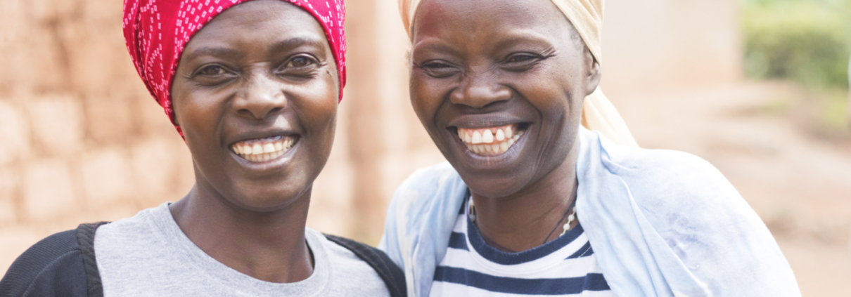 Two artisans smiling at camera
