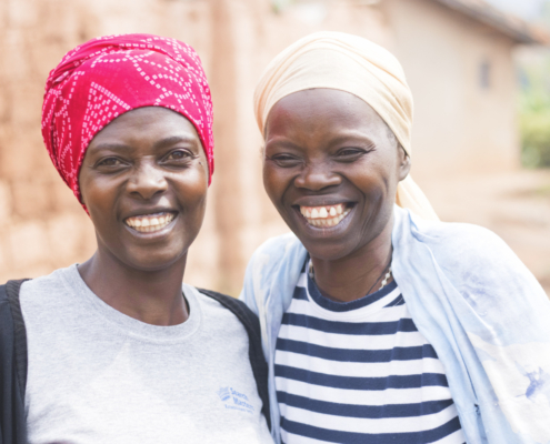 Two artisans smiling at camera
