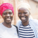 Two artisans smiling at camera
